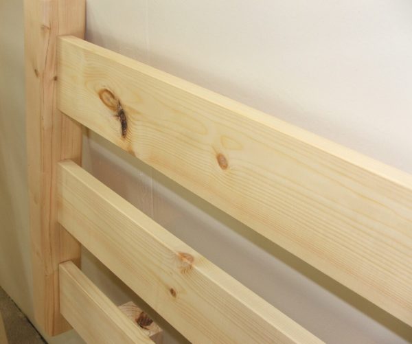 single pine headboard detail